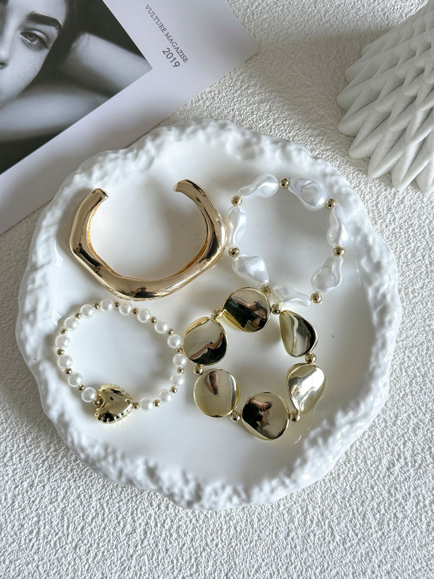 Gold and pearl stack bracelets