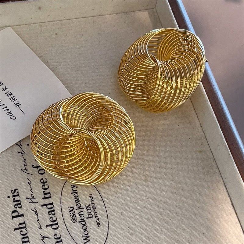 Exaggerated gold spiral mesh earrings