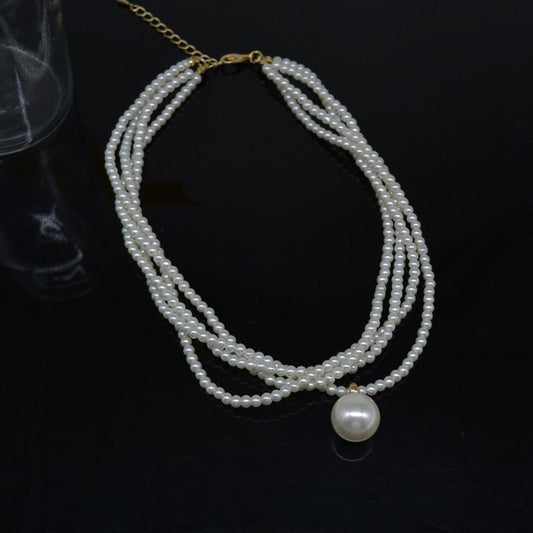 Round pendant layered pearls