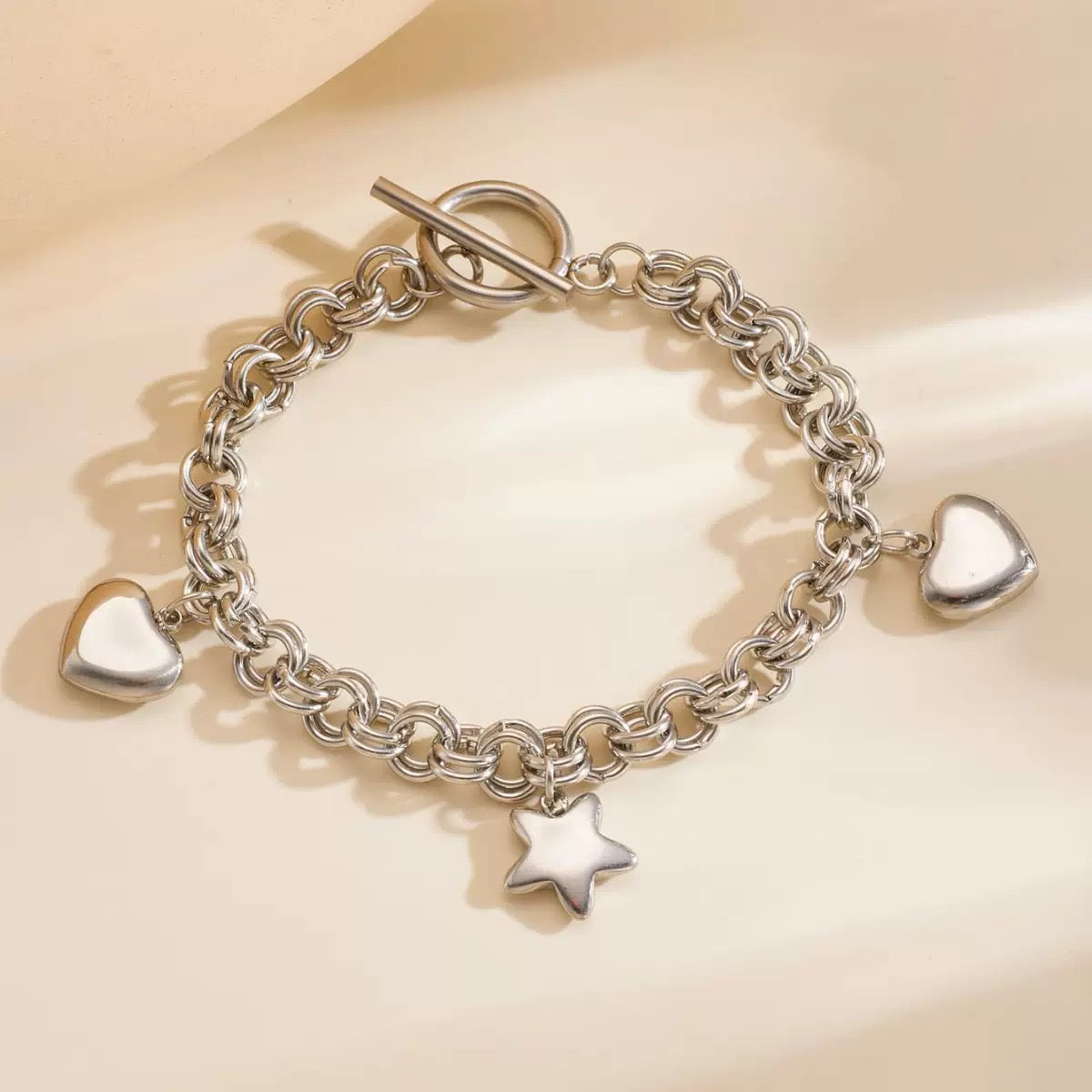 Stainless hearts and star charm bracelet