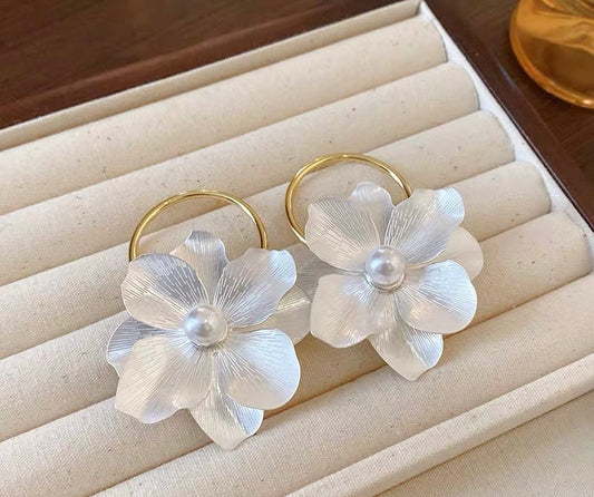 White floral and gold hoop earrings