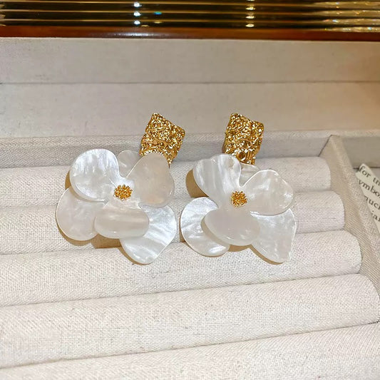 White and gold resin earrings