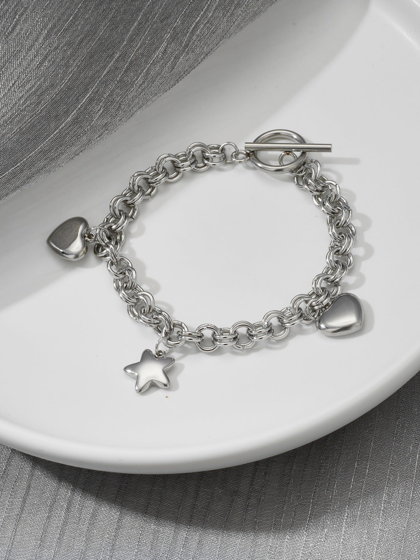 Stainless hearts and star charm bracelet