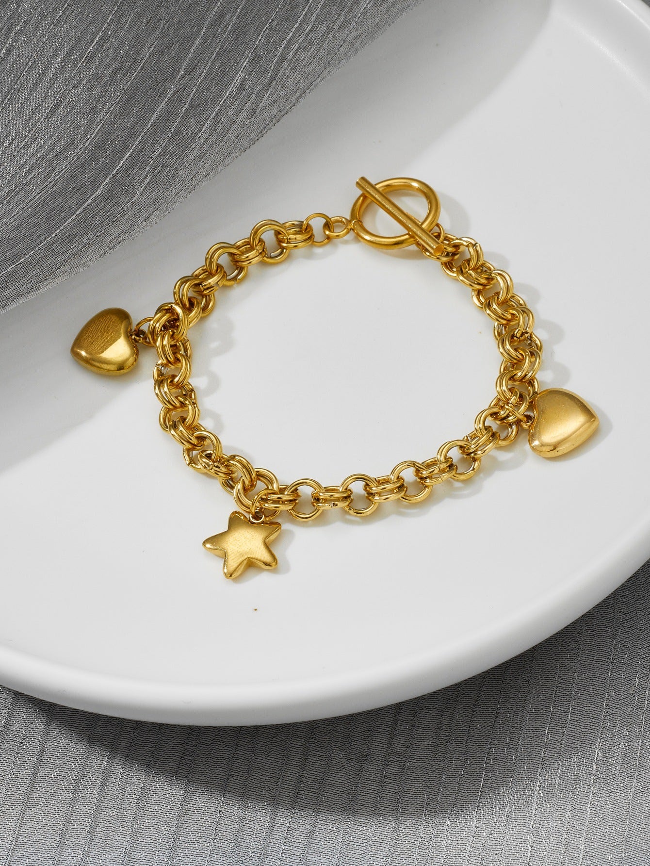 Stainless steel hearts and star charm bracelet