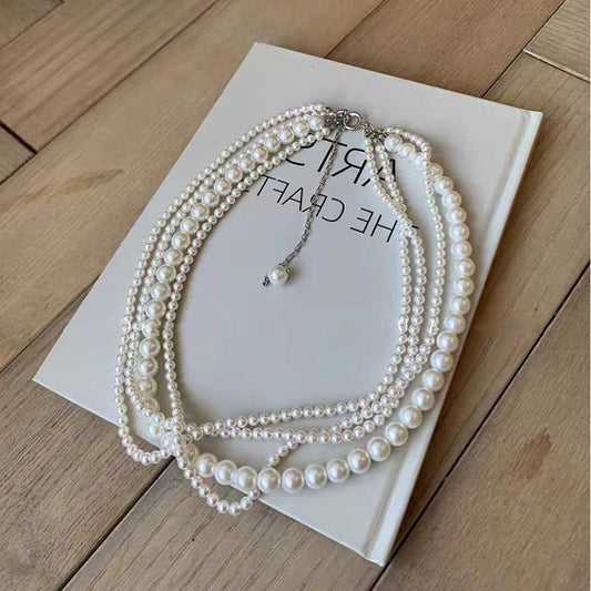 Loose four tier pearl necklace